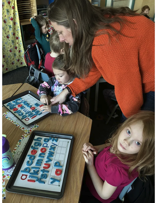 child with alphabet letters